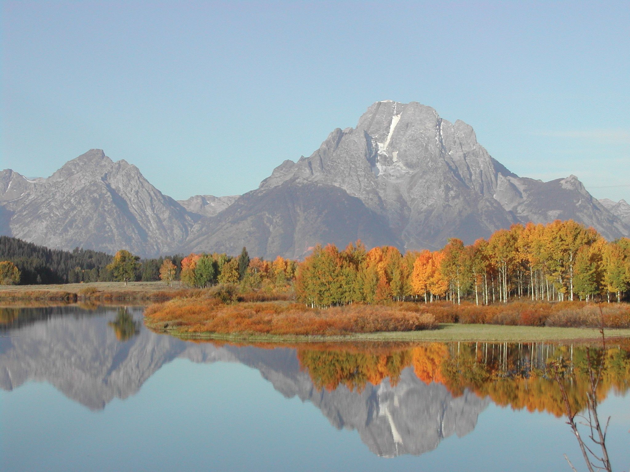 Mount Moran is reflected in the Snake River at Grand Teton National Park. National parks have been popular  destinations in the pandemic era.