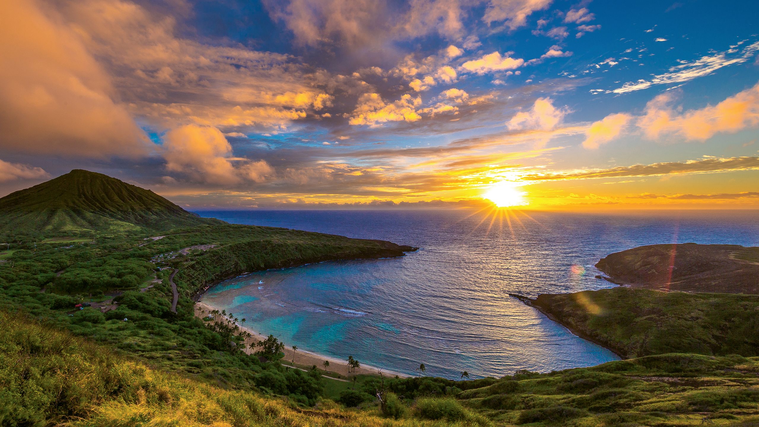 Sunrise from Hanauma Bay Nature Preserve on Oahu. The park is closed one day a week, and first-time visitors must watch a video on safety and conservation. Photo by Shane Myers Photography/Shutterstock.com